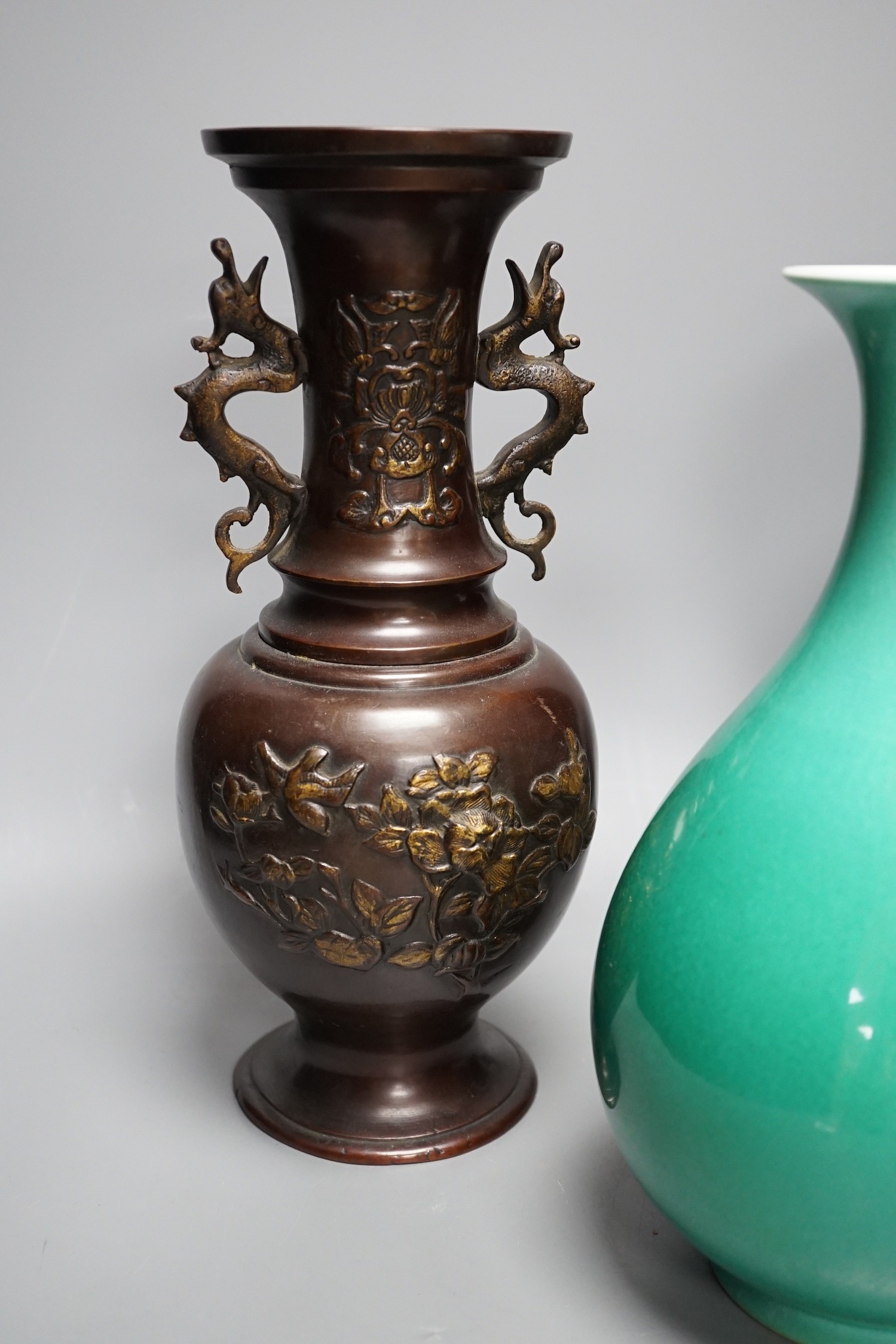 A Chinese green glazed vase with Qianlong seal mark to base and two Japanese bronze vases, tallest 29.5cm